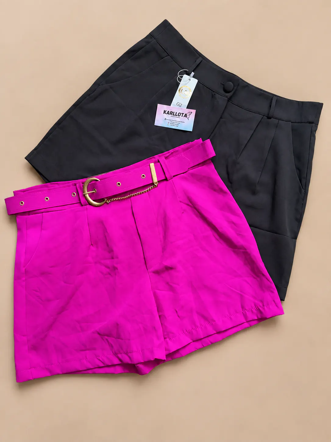 Shorts alfaiataria Plus nas cores preta e pink.